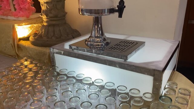Glass cups. Many glass cups can be seen neatly arranged upside down on the table, these glasses are for large events such as meetings and weddings.