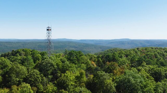 Devils Knob Lookout And Dense Arkansas Forest At Daytime - Drone Forward