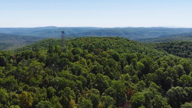 Devils Knob Lookout Tower And Surrounding Mountains In Ozark National Forest, AR, USA - Drone Shot