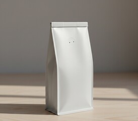 Minimalist coffee packaging mockup featuring a blank white resealable pouch placed on a light wooden background.