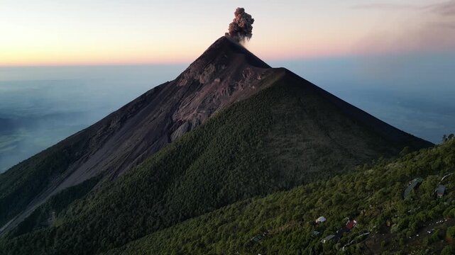 large volcano acatenango erupting in guatemala highlands (famous volcanic hike tourist destination fuego lava smoke) sunrise hiking daybreak geology stunning adventure travel camping antigua getaway