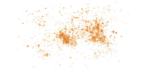 A close-up view of irregularly scattered orange particles, resembling fine powder or spice, isolated on a white background.