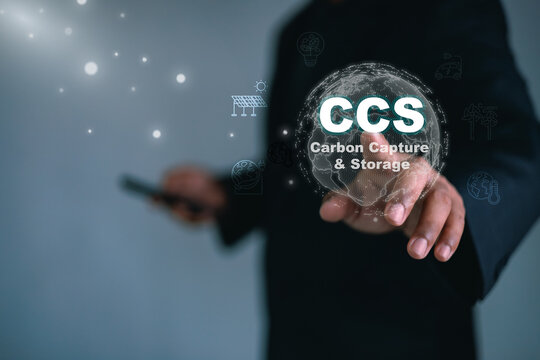 Business professional interacting with CCS carbon capture and storage technology interface,representing climate change mitigation,carbon reduction,clean energy innovation,sustainable global solutions.