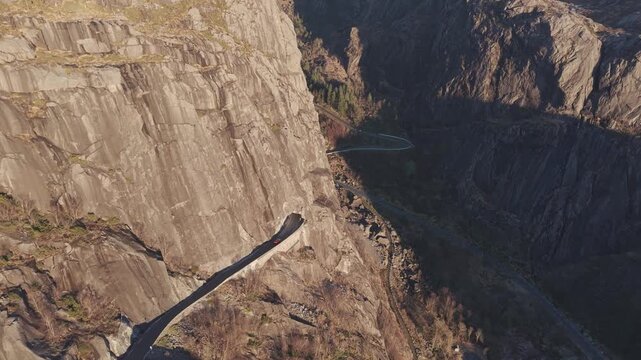 Mountain road entering and exiting a tunnel in Southern Norway. Drone footage