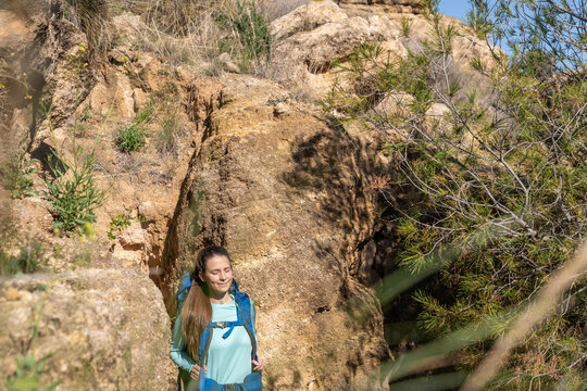 Woman hiking enjoying a sunny outdoor adventure