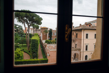 Naklejka premium View of Roman Garden Through Window
