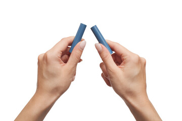two hands breaking blue chalk on white background.