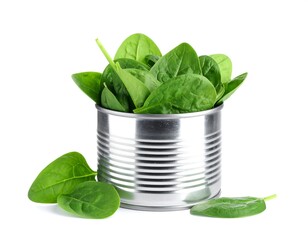Fresh spinach leaves in a metal tin can