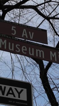 5th avenue museum mile sign on street signpost (light pole) in manhattan new york city upper east side (travel tourism art museums)