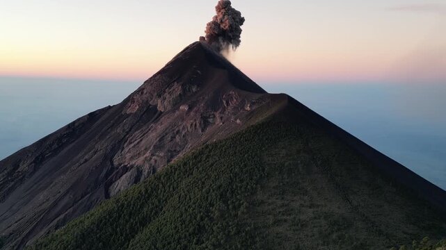 large volcano acatenango erupting in guatemala highlands (famous volcanic hike tourist destination fuego lava smoke) sunrise hiking daybreak geology stunning adventure travel camping antigua getaway