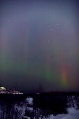 Fototapeta premium Aurora borealis, polar lights with Milky Way stars.