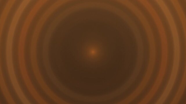 Circular glow pattern expanding in warm orange tones