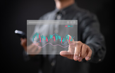 Businessman analyzing digital stock market candlestick chart on virtual interface