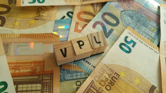 VPL acronym made of wooden letter cubes on pile of Euro banknotes. Vervroegde Pensioenlasten (Early Pension Costs)