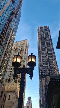 Vertical View of Vintage Street Lights and Modern Skyscrapers of Downtown Chicago USA