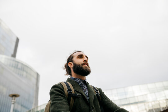 Portrait of bearded man in the city