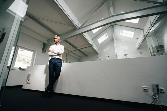 Mature businessman in office thinking