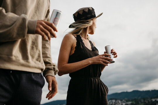 Young couple having a drink outdoors