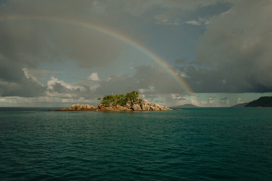 Single Rainbow over Small Tropical Island with Sunlight, Seychel