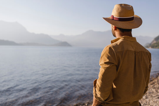 Italy, Lierna, back view of man looking at lake