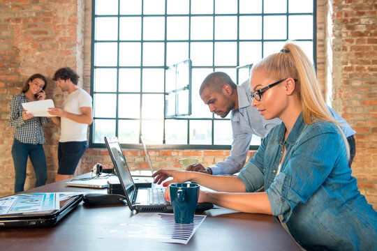 Young business people in office preparing foundation of a start-up company