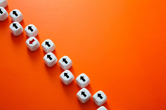 White dice with arrows showing contrasting direction