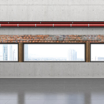 Modern interior with exposed brick wall and city view through large windows