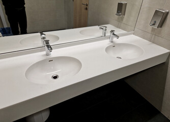 Fototapeta premium double sink made of artificial stone, solid surface material made of composite artificial stone material, non-porous and easy maintain, with oval bowl, seamless joints, and is resistant to stain mold.