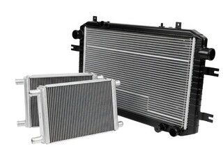 Fototapeta premium Two black radiators with intricate designs and multiple fins for heat dissipation