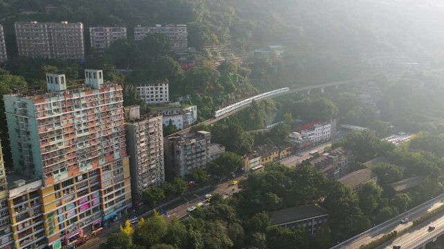 Monorail Transit Train Passing Through Liziba Station In Chongqing, China. Aerial Shot