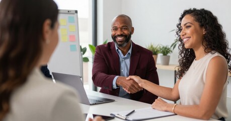 Fototapeta premium Successful job interview: Candidate shaking hands with hiring manager, welcoming new employee, expressing confidence and professionalism