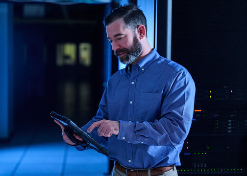 Man using tablet in data center