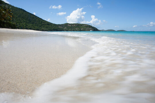 USA, United States Virgin Islands, St. John, Close-up of surf washing sandy beach