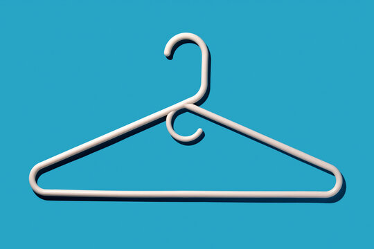 White coat hanger on blue background