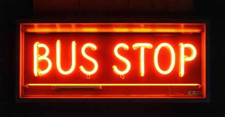 Obraz premium Bright neon sign displays BUS STOP. Rectangular frame glows orange against dark background. Simple, direct messaging.