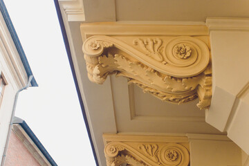 Sunrise casts glow over old street. Morning brightness fills picturesque street scene. Sunrise illuminates cozy alleyways with shadowy warmth and vibrant building details © Евгений Вершинин