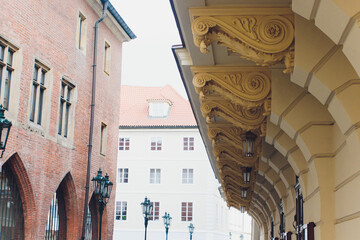 Sunrise casts glow over old street. Morning brightness fills picturesque street scene. Sunrise illuminates cozy alleyways with shadowy warmth and vibrant building details © Евгений Вершинин