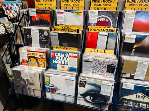 Joy Division Unknown Pleasures vinyl records on display in a shop with other classic albums