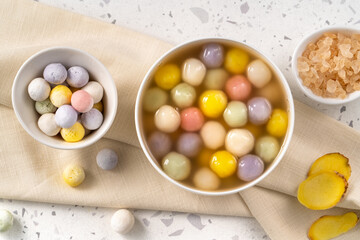 Colorful sweet glutinous rice balls tangyuan in sweet ginger syrup soup
