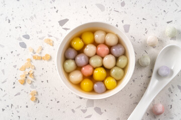 Colorful sweet glutinous rice balls tangyuan in sweet ginger syrup soup