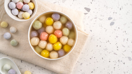 Colorful sweet glutinous rice balls tangyuan in sweet ginger syrup soup