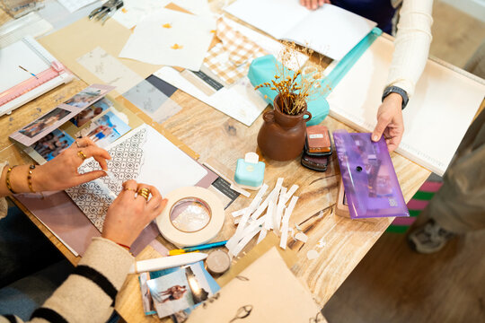 Crafting handmade album during scrapbooking workshop