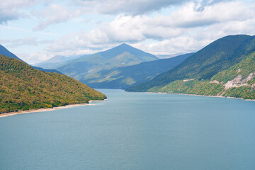 Mountains and water create a scenic view in nature during the daytime near the lake