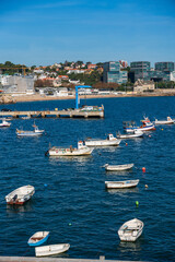 Fototapeta premium Boats moored on the coast on a sunny day. Portugal, Cascais