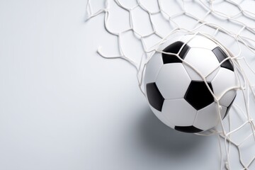 Obraz premium Modern Soccer Ball in Net with Clean Copyspace for Advertisement Use