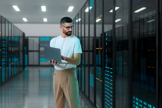 3D man with laptop in server data network corridor
