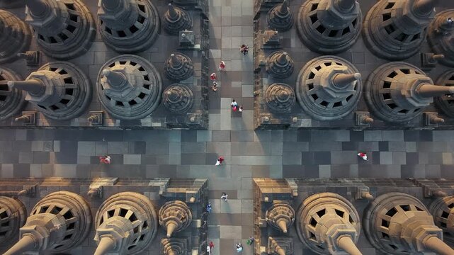 Aerial view of ancient Borobudur temple complex with intricate stupa design and symmetrical pathways