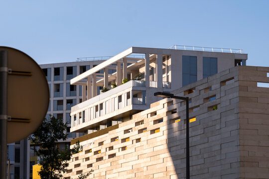 Modern architecture apartments in Montpellier France with residential stone facade showing complex volumes for contemporary urban housing development