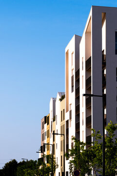 Modern architecture apartments in Montpellier France with residential facade balconies on street under open sky for contemporary urban housing