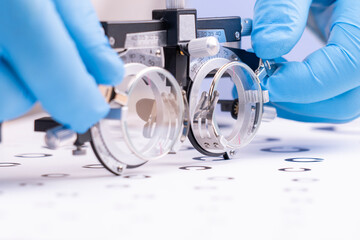 Optometrist vision test. The doctor selects diopters for the patient. Selection of glasses for vision. High quality photo